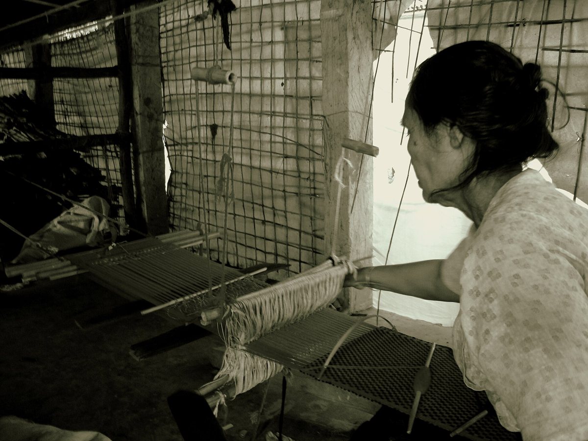 A Rakhine woman weaving